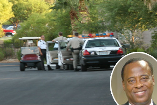 FlashCity.com/AP composite Officials raided the Las Vegas home of Michael Jackson's personal physician on Tuesday morning.
