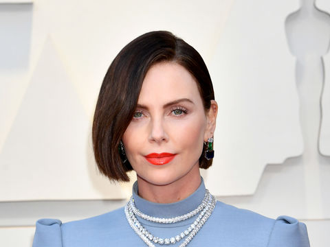 Charlize Theron Hits the Oscars Red Carpet as a Brunette