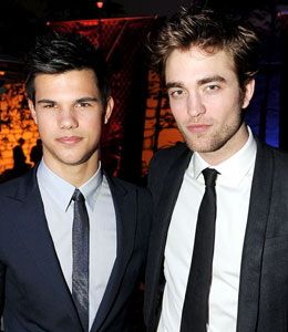 Getty Images Robert Pattinson and Taylor Lautner pucker up?!